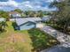 Aerial view of a charming home with a large yard at 1004 Peninsula Ave, Tarpon Springs, FL 34689