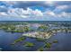 Wide aerial showcasing waterfront community and homes at 1004 Peninsula Ave, Tarpon Springs, FL 34689