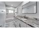 Bathroom with granite countertop and bathtub at 1004 Peninsula Ave, Tarpon Springs, FL 34689