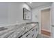 Modern bathroom with granite countertop and sleek fixtures at 1004 Peninsula Ave, Tarpon Springs, FL 34689