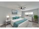 Serene bedroom with teal accents and ceiling fan at 1004 Peninsula Ave, Tarpon Springs, FL 34689