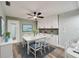 Bright dining room featuring a white table and chairs at 1004 Peninsula Ave, Tarpon Springs, FL 34689