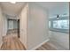 Clean hallway with light walls and wood-look floors at 1004 Peninsula Ave, Tarpon Springs, FL 34689