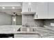 Modern kitchen with granite countertops and stainless steel sink at 1004 Peninsula Ave, Tarpon Springs, FL 34689