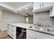 Modern kitchen with granite countertops and stainless steel sink at 1004 Peninsula Ave, Tarpon Springs, FL 34689