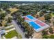 Aerial view of well-maintained tennis courts in a residential community at 1004 Peninsula Ave, Tarpon Springs, FL 34689