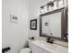 Modern bathroom with white vanity, updated fixtures, and stylish mirror at 10515 Fenceline Rd, New Port Richey, FL 34655