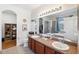 Double vanity bathroom with granite countertop and shower at 10515 Fenceline Rd, New Port Richey, FL 34655