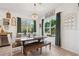 Kitchen dining area with farmhouse table and bench seating at 10515 Fenceline Rd, New Port Richey, FL 34655