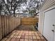 Small backyard with a patio and wooden fence at 11356 Stratton Park Dr, Temple Terrace, FL 33617