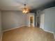 Primary bedroom with laminate wood flooring and an en-suite bathroom at 11356 Stratton Park Dr, Temple Terrace, FL 33617