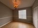 Light-filled dining room features wood floors and a chandelier at 11356 Stratton Park Dr, Temple Terrace, FL 33617