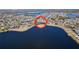 Wide aerial view of a community with a lake at 11525 Lake Lucaya Dr, Riverview, FL 33579