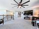 Loft with ceiling fan, TV and additional seating at 11525 Lake Lucaya Dr, Riverview, FL 33579