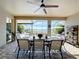 Covered patio with outdoor dining set and lake view at 11525 Lake Lucaya Dr, Riverview, FL 33579