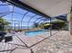 Screened pool and patio area with lake view at 11525 Lake Lucaya Dr, Riverview, FL 33579