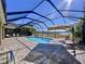 Screened pool and patio area with lake view at 11525 Lake Lucaya Dr, Riverview, FL 33579