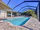 Inviting pool and patio area with screened enclosure, creating a relaxing outdoor space at 11525 Lake Lucaya Dr, Riverview, FL 33579