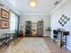 Spacious wine room featuring wine racks, shelving, and a cozy sitting area at 11525 Lake Lucaya Dr, Riverview, FL 33579