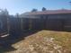 Backyard with wooden fence and gate at 1434 Cleveland St # 4, Clearwater, FL 33755