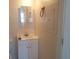 Small bathroom with white vanity and mirror at 1434 Cleveland St # 4, Clearwater, FL 33755