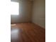 Simple bedroom with wood flooring and window at 1434 Cleveland St # 4, Clearwater, FL 33755