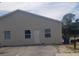 Tan single-story building with parking area at 1434 Cleveland St # 4, Clearwater, FL 33755