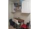 Small kitchen breakfast bar with two white stools at 1434 Cleveland St # 4, Clearwater, FL 33755