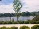 Tranquil lake view from a lakeside path at 1434 Cleveland St # 4, Clearwater, FL 33755