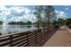 Scenic boardwalk path with lake and fountain views at 1434 Cleveland St # 4, Clearwater, FL 33755