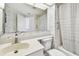 Bathroom with a bathtub, toilet and patterned wallpaper at 1540 Gulf Blvd # 2004, Clearwater, FL 33767