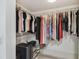 Large walk-in closet with double hanging rods and shelving at 1540 Gulf Blvd # 2004, Clearwater, FL 33767