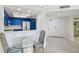 Modern kitchen with white quartz countertops and blue cabinets at 1540 Gulf Blvd # 2004, Clearwater, FL 33767