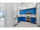 Bright kitchen with stainless steel appliances and blue cabinets at 1540 Gulf Blvd # 2004, Clearwater, FL 33767