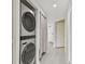 Stackable washer and dryer in a small laundry room at 1540 Gulf Blvd # 2004, Clearwater, FL 33767