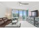 Living room with ocean view and modern furnishings at 1540 Gulf Blvd # 2004, Clearwater, FL 33767