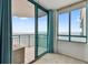 Living room with sliding doors opening to a balcony and ocean view at 1540 Gulf Blvd # 2004, Clearwater, FL 33767