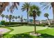 Relaxing putting green with palm trees and landscaping at 1540 Gulf Blvd # 2004, Clearwater, FL 33767