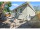 Backyard showing house exterior, grassy area, and wooden fence at 1584 S Washington Ave, Clearwater, FL 33756