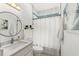 Updated bathroom with a vanity, toilet, and shower at 1584 S Washington Ave, Clearwater, FL 33756