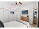 Bedroom with a queen bed, dresser, and TV at 1584 S Washington Ave, Clearwater, FL 33756