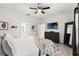 Spacious main bedroom with king bed, and ensuite bathroom at 1584 S Washington Ave, Clearwater, FL 33756