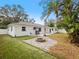 Large backyard with fire pit and patio at 1768 Algonquin Dr, Clearwater, FL 33755