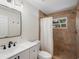 Renovated bathroom with updated vanity, shower, and tile flooring at 1768 Algonquin Dr, Clearwater, FL 33755