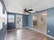 Bright bonus room, wood-look floors, and kitchen view at 1768 Algonquin Dr, Clearwater, FL 33755