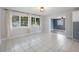 Dining area with tile floor and view to office at 1768 Algonquin Dr, Clearwater, FL 33755