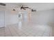 Spacious living room with tile floors and ceiling fans at 1768 Algonquin Dr, Clearwater, FL 33755