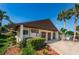 Community center building with landscaping and signage at 1882 Pine Ridge W Way # E1, Palm Harbor, FL 34684