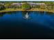 Community lake with central fountain at 1882 Pine Ridge W Way # E1, Palm Harbor, FL 34684