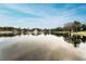 Scenic lake view reflecting the surrounding buildings at 1882 Pine Ridge W Way # E1, Palm Harbor, FL 34684